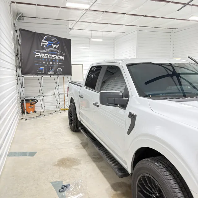 White pickup after window tinting at Precision Film Works